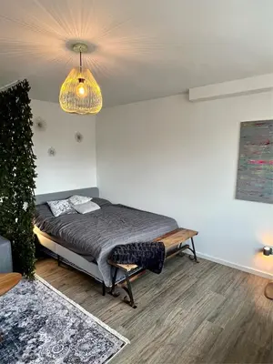 Ein Bett oder Betten in einem Zimmer der Unterkunft Stillvolles Apartment mitten in little Tokyo