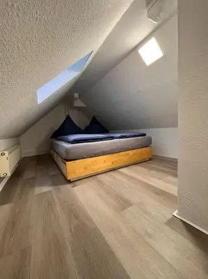 Ein Bett oder Betten in einem Zimmer der Unterkunft Helle 80qm Wohnung mit weitem Ausblick