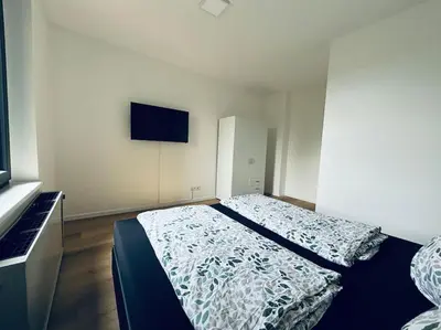 Ein Bett oder Betten in einem Zimmer der Unterkunft Große 80qm Wohnung mit mehreren Zimmern