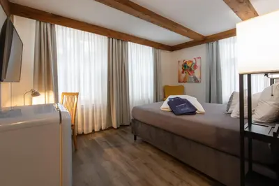 Ein Bett oder Betten in einem Zimmer der Unterkunft Hotel Stadt Lüdenscheid, Domizil Herzogstraße