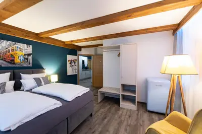 Ein Bett oder Betten in einem Zimmer der Unterkunft Hotel Stadt Lüdenscheid, Domizil Herzogstraße