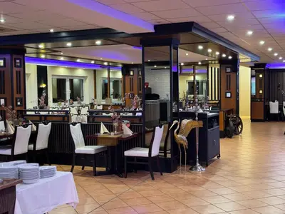 Ein Restaurant oder anderes Speiselokal in der Unterkunft Bootshaus Hamm