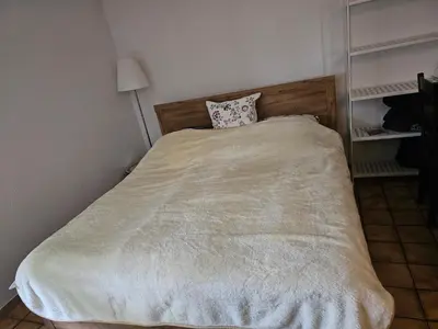 Ein Bett oder Betten in einem Zimmer der Unterkunft Ferienwohnung Löhr Essen Kettwig
