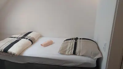 Ein Bett oder Betten in einem Zimmer der Unterkunft Wohnung Mg