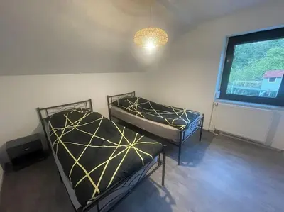 Ein Bett oder Betten in einem Zimmer der Unterkunft FeWo-Ruhr