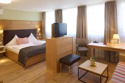 Ein Bett oder Betten in einem Zimmer der Unterkunft Jammertal Resort
