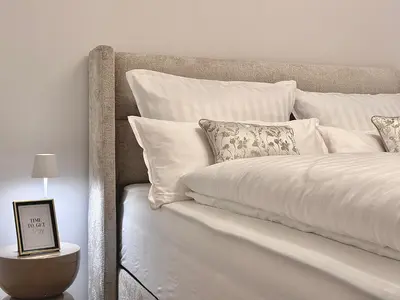 Ein Bett oder Betten in einem Zimmer der Unterkunft Gemütliches Design Apartment in Do-Zentrum