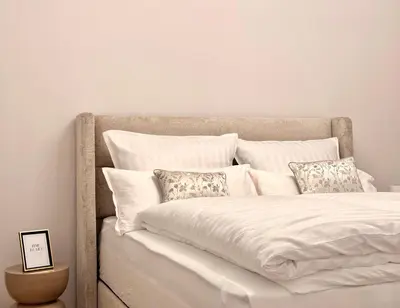 Ein Bett oder Betten in einem Zimmer der Unterkunft Gemütliches Design Apartment in Do-Zentrum