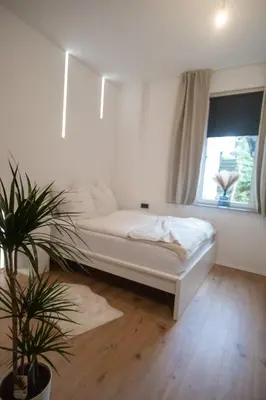 Ein Bett oder Betten in einem Zimmer der Unterkunft Apartment 