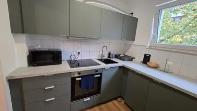 Küche/Küchenzeile in der Unterkunft guestified BEETHOVEN Serviced Apartments