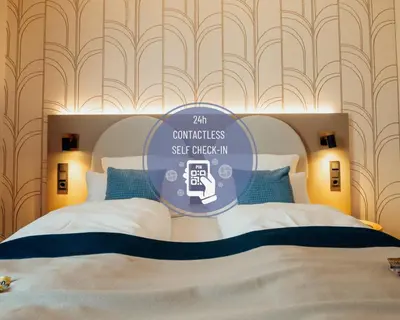Ein Bett oder Betten in einem Zimmer der Unterkunft guestified BEETHOVEN Serviced Apartments