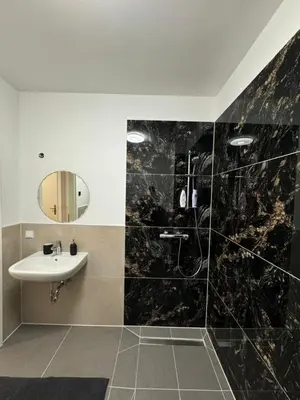 Ein Badezimmer in der Unterkunft Zeitperlewohnen Beige