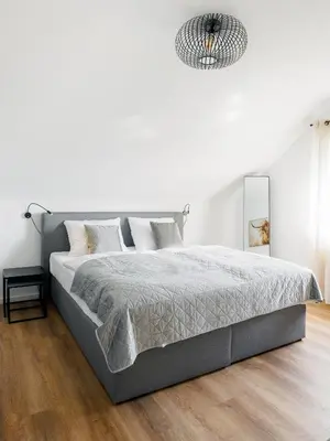 Ein Bett oder Betten in einem Zimmer der Unterkunft VISTAMO Dorsten-Rhade, modernes Apartment