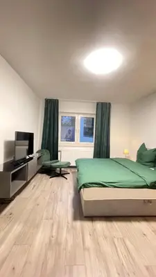 Ein Bett oder Betten in einem Zimmer der Unterkunft Home Apartments