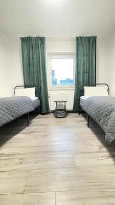Ein Bett oder Betten in einem Zimmer der Unterkunft Home Apartments