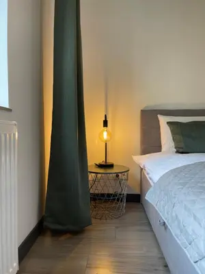 Ein Bett oder Betten in einem Zimmer der Unterkunft Home Apartments