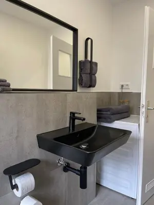 Ein Badezimmer in der Unterkunft Home Apartments