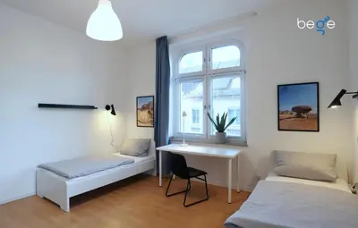 Ein Bett oder Betten in einem Zimmer der Unterkunft BEGE APARTMENTS Corporate Corner