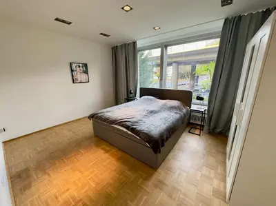 Ein Bett oder Betten in einem Zimmer der Unterkunft Schönster Rheinblick Messe Parken Luxus 10 Person