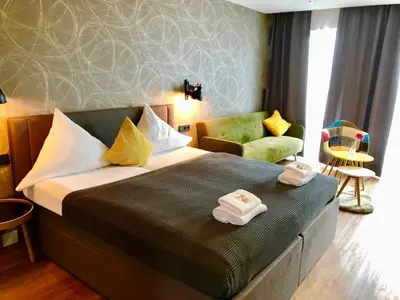Ein Bett oder Betten in einem Zimmer der Unterkunft Niteroom Boutiquehotel & Apartements