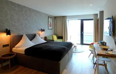 Ein Bett oder Betten in einem Zimmer der Unterkunft Niteroom Boutiquehotel & Apartements