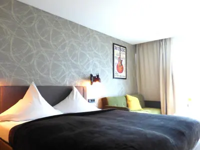 Ein Bett oder Betten in einem Zimmer der Unterkunft Niteroom Boutiquehotel & Apartements