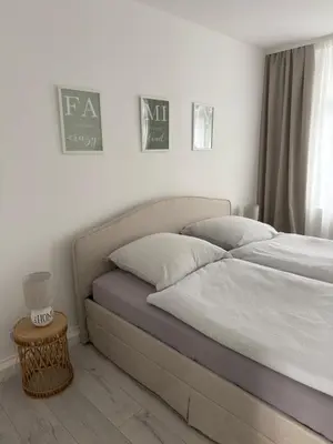 Ein Bett oder Betten in einem Zimmer der Unterkunft Ferienwohnung in der Wülfrather Altstadt