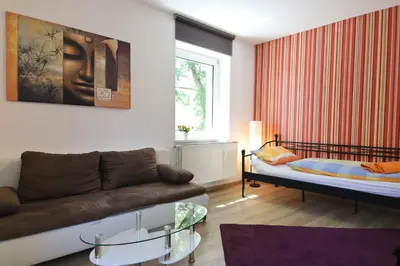 Ein Bett oder Betten in einem Zimmer der Unterkunft Top Apartmentwohnungen Veltins Arena