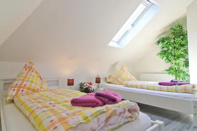 Ein Bett oder Betten in einem Zimmer der Unterkunft Top Apartmentwohnungen Veltins Arena