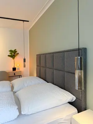 Ein Bett oder Betten in einem Zimmer der Unterkunft Moderne City-Wohnung mit Self Check-In und Free Wifi im Zentrum