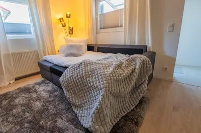 Ein Bett oder Betten in einem Zimmer der Unterkunft Marisol Design Apartment mit eigenem Stellplatz