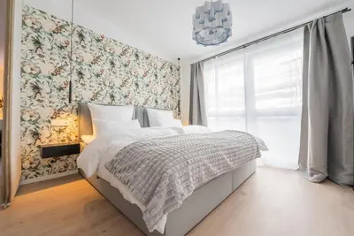 Ein Bett oder Betten in einem Zimmer der Unterkunft Marisol Design Apartment mit eigenem Stellplatz