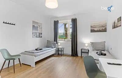 Ein Bett oder Betten in einem Zimmer der Unterkunft BEGE APARTMENTS Business Oasis