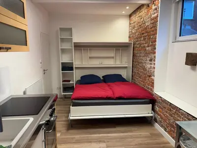 Ein Bett oder Betten in einem Zimmer der Unterkunft Apartment nah Flughafen, Messe, Arena, Dome