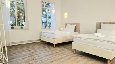 Ein Bett oder Betten in einem Zimmer der Unterkunft 122qm-Apartment - 4 Zimmer I Zentral I Küche I Balkon I Parken I WLAN