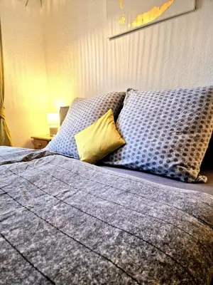 Ein Bett oder Betten in einem Zimmer der Unterkunft Gemütliches Studio nahe Stadion, Westfalenhalle & Innenstadt