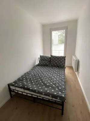Ein Bett oder Betten in einem Zimmer der Unterkunft Moderne zentrale Wohnung