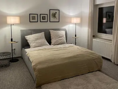 Ein Bett oder Betten in einem Zimmer der Unterkunft FeWo am Ring