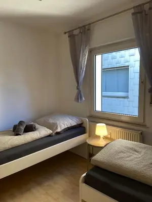 Ein Bett oder Betten in einem Zimmer der Unterkunft Wohnglück 5