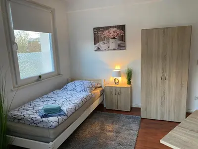 Ein Bett oder Betten in einem Zimmer der Unterkunft Monteurwohnung Nähe MoviePark