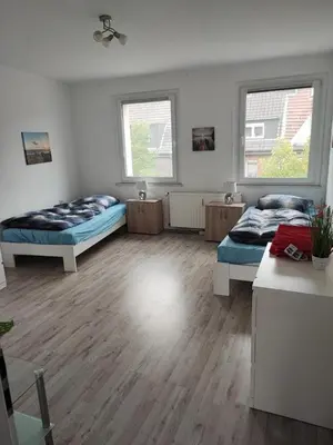 Ein Bett oder Betten in einem Zimmer der Unterkunft Monteurwohnung Nähe MoviePark