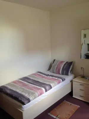 Ein Bett oder Betten in einem Zimmer der Unterkunft Guesthouse AirMinis