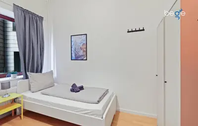 Ein Bett oder Betten in einem Zimmer der Unterkunft BEGE APARTMENTS WorkLounge