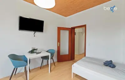 Ein Bett oder Betten in einem Zimmer der Unterkunft BEGE APARTMENTS WorkLounge