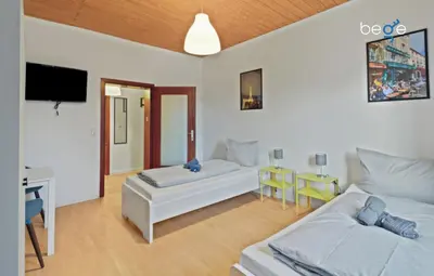 Ein Bett oder Betten in einem Zimmer der Unterkunft BEGE APARTMENTS WorkLounge