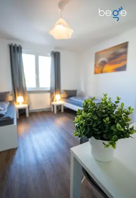 Ein Bett oder Betten in einem Zimmer der Unterkunft BEGE APARTMENTS Corporate Nest