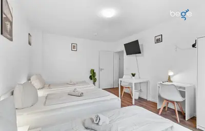 Ein Bett oder Betten in einem Zimmer der Unterkunft BEGE APARTMENTS Corporate Nest