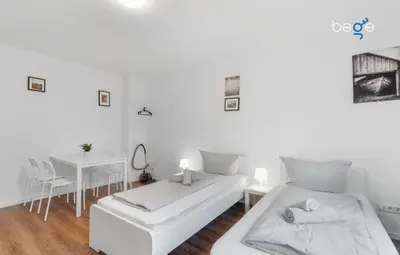 Ein Bett oder Betten in einem Zimmer der Unterkunft BEGE APARTMENTS Corporate Nest