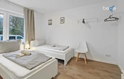 Ein Bett oder Betten in einem Zimmer der Unterkunft BEGE APARTMENTS Corporate Nest