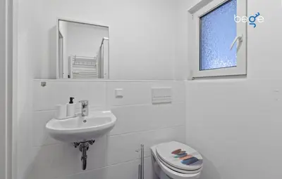 Ein Badezimmer in der Unterkunft BEGE APARTMENTS Corporate Nest